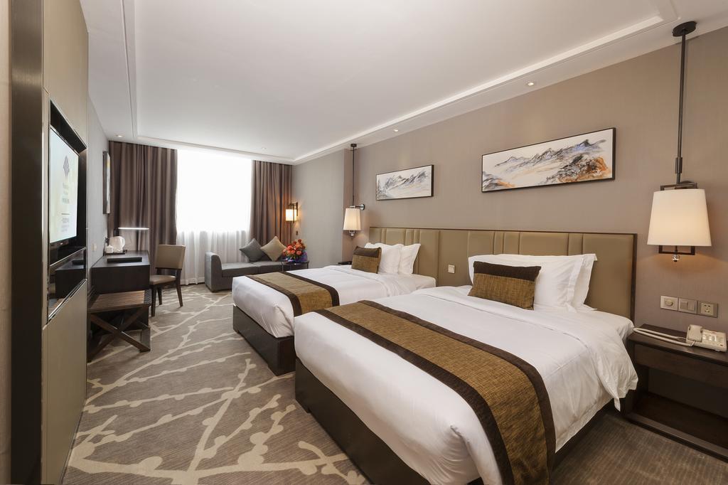 Phoenix Valley Holiday Hotel Джухай Стая снимка